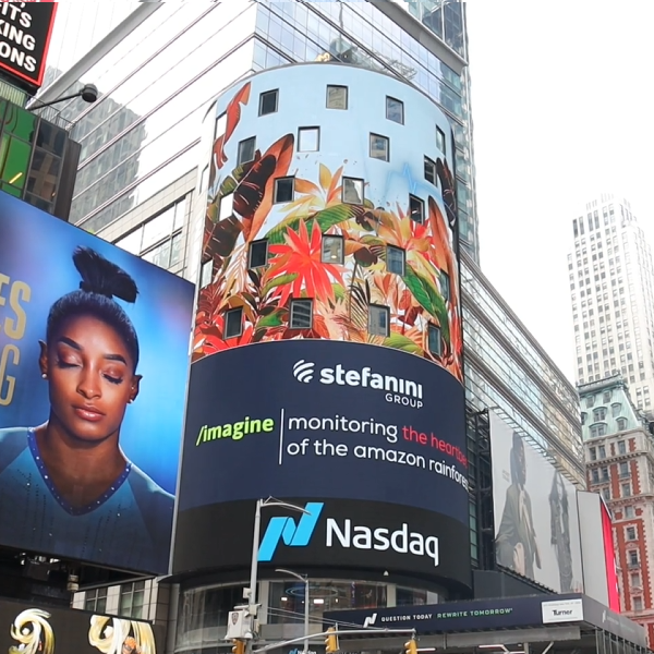 A view of the Times square Nasdaq building with a rainforest video playing.
